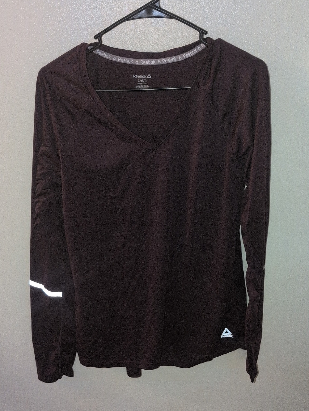 Reebok Women's Long Sleeve V-Neck Top in Maroon with Reflective Accents